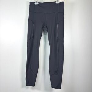 Athleta Rainier Legging Med‎ Black Lined Zip Pockets Running Cold Weather Tight